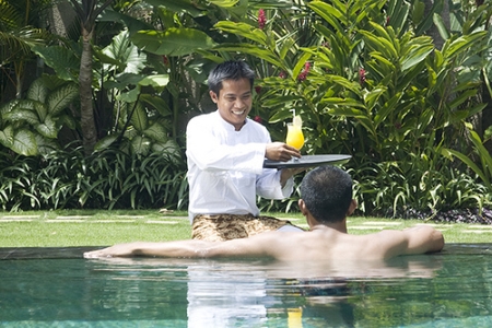 File:Butler serving drink in Bali.jpg