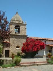 (CC) Photo: Stephen Lea Mission Carmel's campanile ("bell tower") as seen from the central courtyard in June 2004.