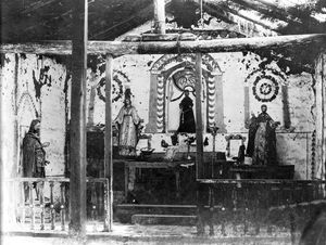 (PD) Photo: Charles C. Pierce The dilapidated altar at the San Antonio at Pala Asistencia, circa 1898, displaying four wooden statues crafted by Indian artisans.