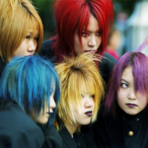 'Cosplayers' (from コスプレ kosupure 'costume roleplay') - teenagers who dress as characters from film, television or animé cartoons - pose for the cameras in Harajuku, Tokyo. These girls are dressed as members of the Japanese band 'Dir en grey'. Photo © by Sonny Santos, used by permission.