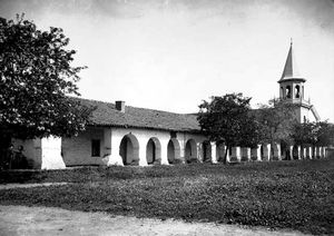 (PD) Photo: William Henry Jackson A photograph of Mission San Juan Bautista taken between 1880 and 1910. The steeple (far right), constructed after the mission was secularized, was subsequently destroyed in a fire.