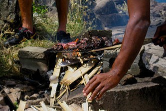 Whale meat being grilled, Semplers Cay, Bequia, St. Vincent & the Grenadines.