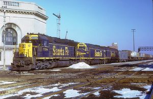 © Photo: Dan Tracy Santa Fe No. 5598 (an EMD SD45 locomotive) leads Train 891, the eastbound Super C, past the Joliet Union Station in February, 1973.[1]
