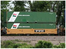 Intermodal shipping containers on a railway flat car