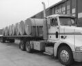 18 wheel transport truck loaded with rolls of paper.jpg