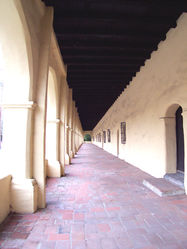 (CC) Photo: Robert A. Estremo A view looking down a typical exterior corridor at Mission San Fernando Rey de España.